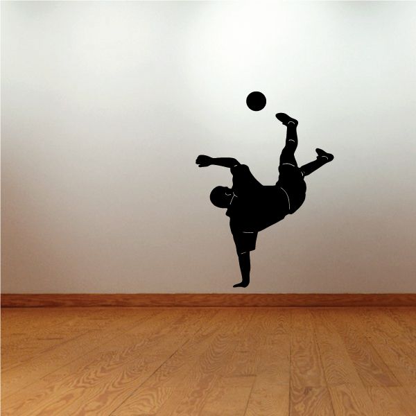 Soccer wall decal: black soccer player kicking a ball silhouette