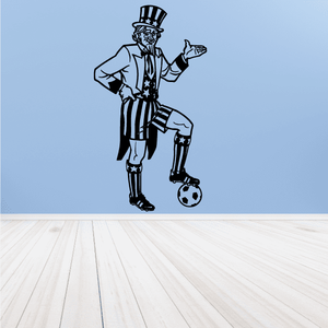 Soccer wall decal of a black-and-white striped player in top hat, holding a ball