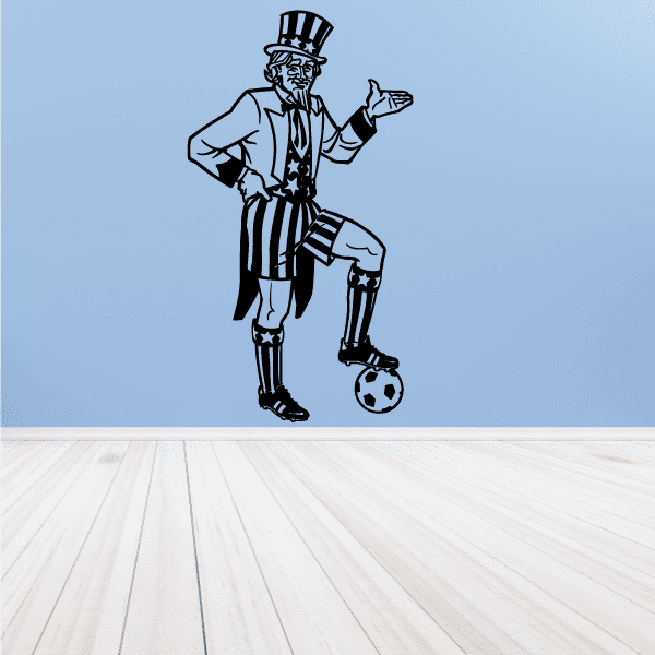 Soccer wall decal of a black-and-white striped player in top hat, holding a ball