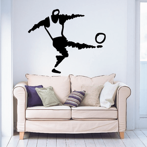 Black soccer wall decal of a kicking player silhouette