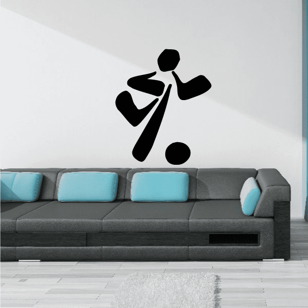 Soccer wall decal of a black soccer player silhouette with a ball