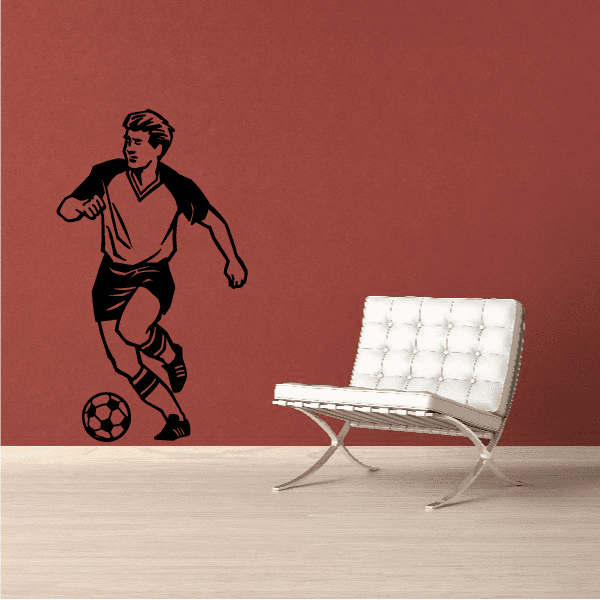 Soccer wall decal of a running player with a soccer ball