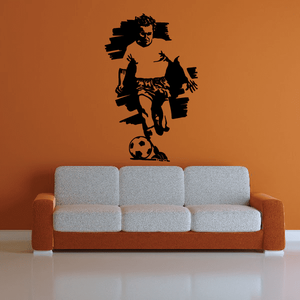 Soccer wall decal vinyl: black silhouette of soccer player kicking a ball