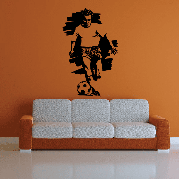 Soccer wall decal vinyl: black silhouette of soccer player kicking a ball