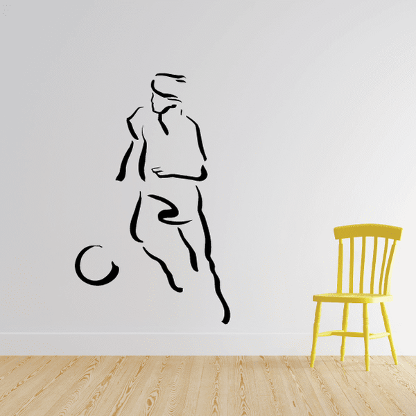 Soccer wall decal of a player silhouette with a small ball, black and white lines