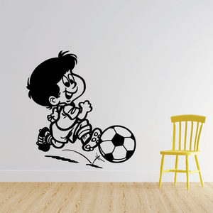 Soccer wall decal of a cartoon child kicking a soccer ball, black and white