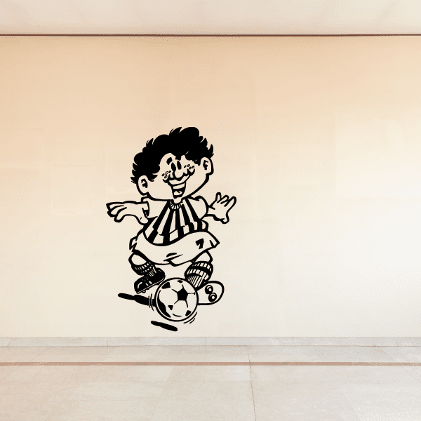 Soccer wall vinyl decal of cartoon player kicking a soccer ball