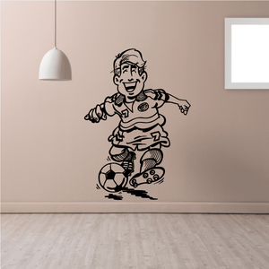 Soccer player wall decal: cartoon boy dribbling soccer ball in black outline