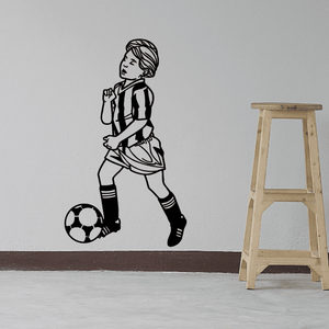 Soccer wall decal of cartoon player in black and white with soccer ball