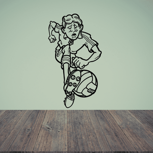 Vinyl soccer wall decal of a black-and-white cartoon soccer player posing with ball