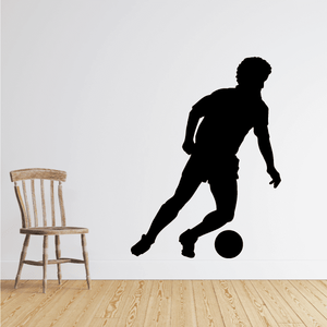 Black soccer player wall decal with ball silhouette
