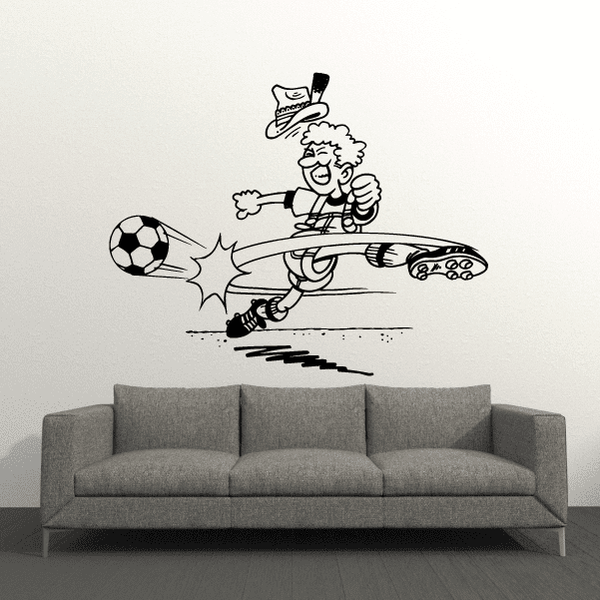 Soccer wall vinyl decal of a cartoon player dribbling and kicking a soccer ball