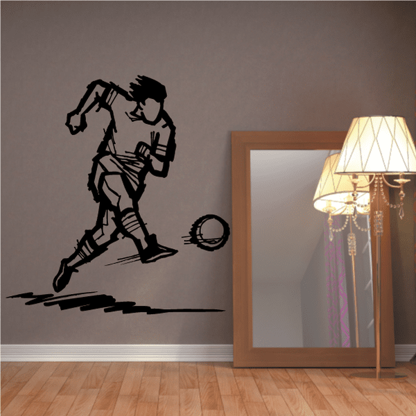 Black vinyl soccer player wall decal with ball, dynamic kicking pose