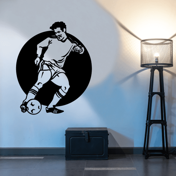 Soccer wall decal of a player kicking a ball inside a black circle