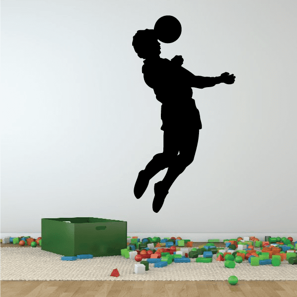 Soccer wall vinyl decal of a black silhouetted player jumping