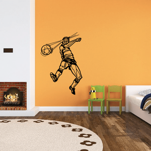 Soccer player wall vinyl decal, black outline kicking a ball