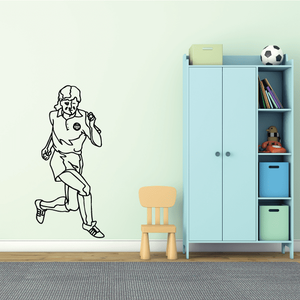 Soccer wall decal vinyl sticker of a black soccer player in kicking pose.