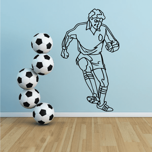 Soccer wall decal vinyl of soccer player outline with four black-and-white soccer balls
