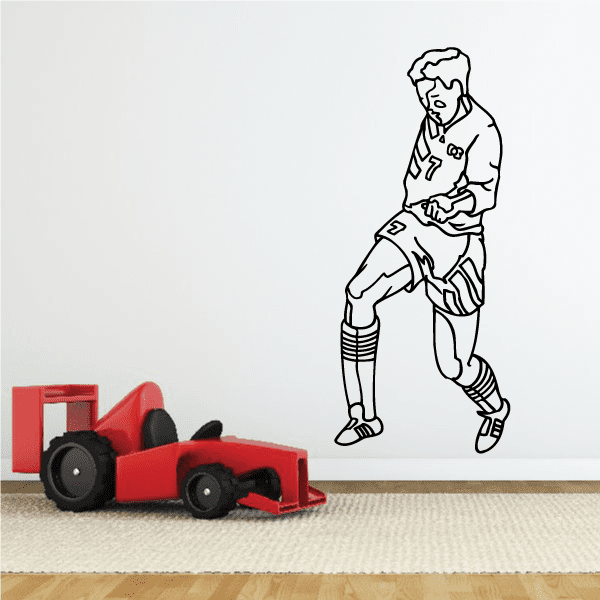 Soccer player wall decal in black outline, holding a soccer ball