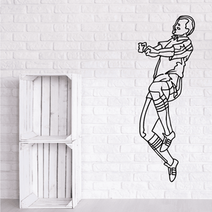 Soccer wall decal of a black-and-white soccer player mid-kick outline.