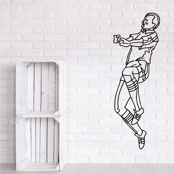 Soccer wall decal of a black-and-white soccer player mid-kick outline.