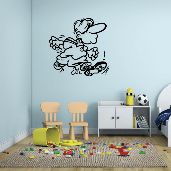 Vinyl soccer wall decal with cartoon player kicking a ball