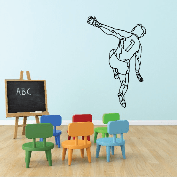 Soccer player wall decal, black outline vinyl graphic of a kick