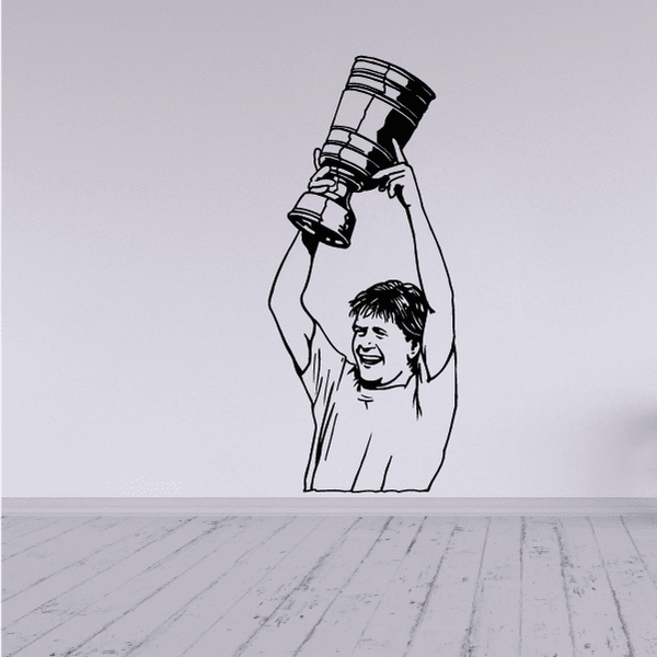 Soccer player wall decal vinyl figure with raised arms and ball above head