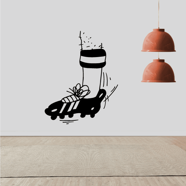 Soccer wall decal of black cleat kicking a striped soccer ball with motion lines