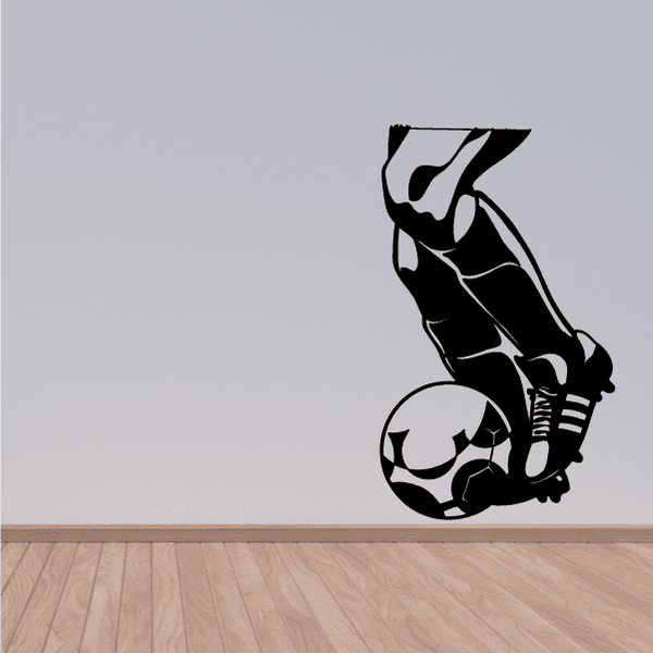 Soccer wall vinyl decal of black soccer player kicking a ball