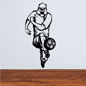 Soccer player wall decal, black vinyl silhouette holding soccer ball.