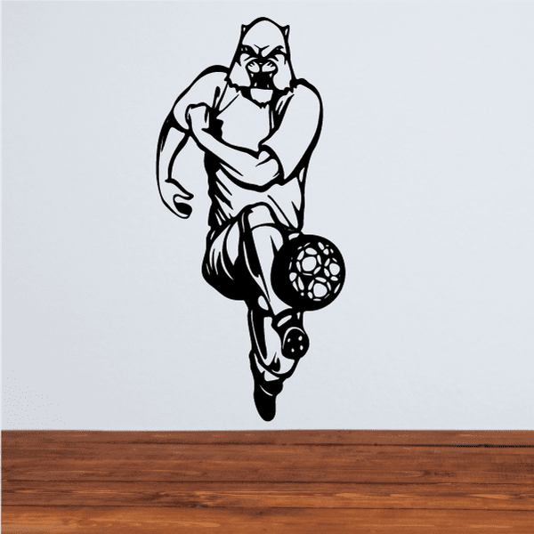 Soccer player wall decal, black vinyl silhouette holding soccer ball.