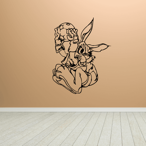 Soccer wall decal: cartoon soccer player holding a ball, outlined in black.