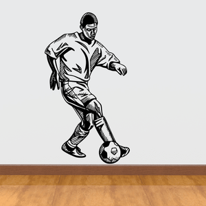 Soccer player wall decal, black vinyl silhouette of a kicking soccer player