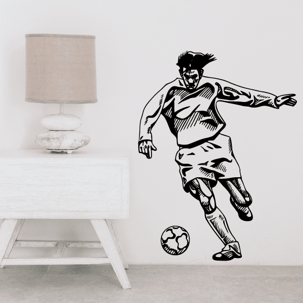 Soccer wall decal showing black cartoon soccer player kicking a ball