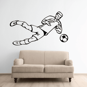 Soccer wall decal of a player kicking a soccer ball, black-and-white vinyl outline