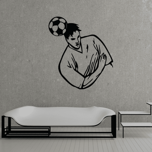 Soccer wall decal: black vinyl player holding a soccer ball