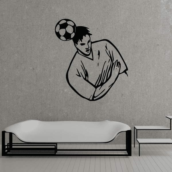 Soccer wall decal: black vinyl player holding a soccer ball