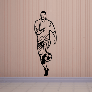 Soccer player wall vinyl decal, black outline holding ball at his feet