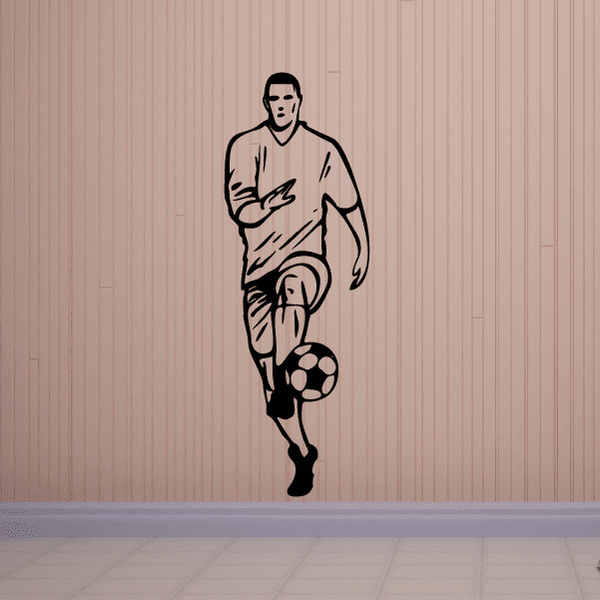 Soccer player wall vinyl decal, black outline holding ball at his feet