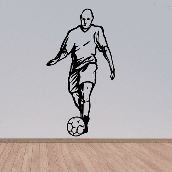 Soccer wall decal of a black soccer player kicking a ball