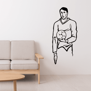Soccer wall decal of a player holding a soccer ball, vinyl outline sticker