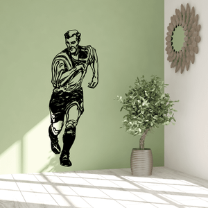 Soccer vinyl wall decal of a black running soccer player silhouette