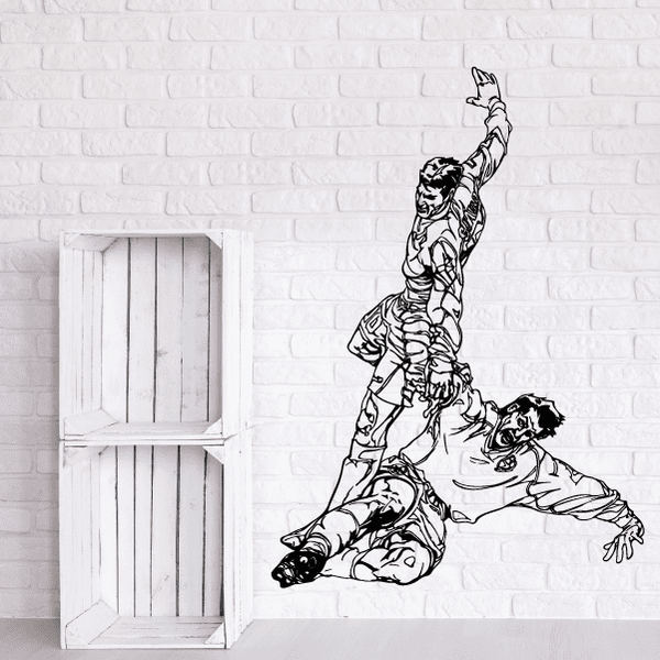 Soccer wall decal vinyl of a black soccer player in action, kneeling with ball.