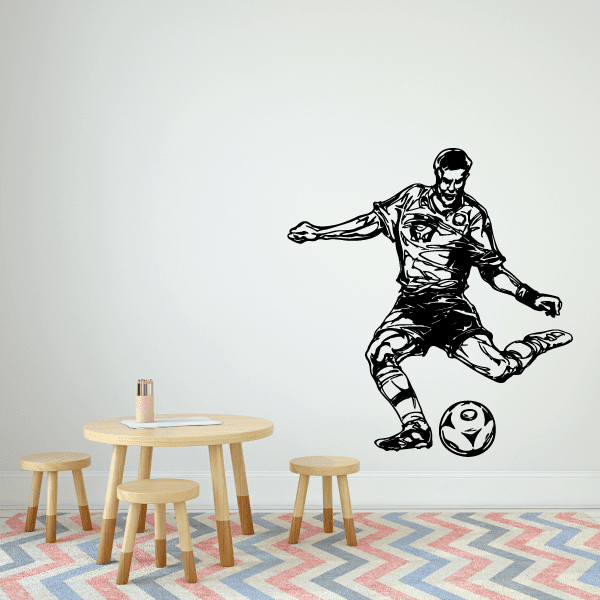 Soccer wall vinyl decal: black player kicking a soccer ball