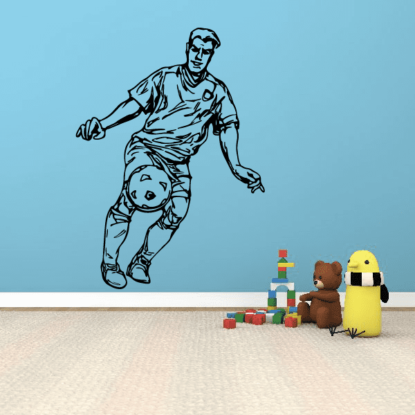 Soccer wall decal of a soccer player dribbling a ball in a black outline