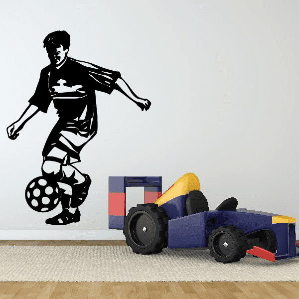 Soccer player wall decal, black vinyl silhouette with ball and raised arm