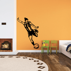 Soccer wall decal vinyl of black soccer player silhouette with ball on wall