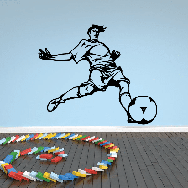 Soccer wall decal of a kicking player silhouette with black and white uniform