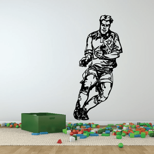 Black soccer player vinyl wall decal silhouette, dribbling ball